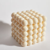 Huge bubble decorative candle angled view – stylish cream cube candle with bubble detail, perfect for home décor.